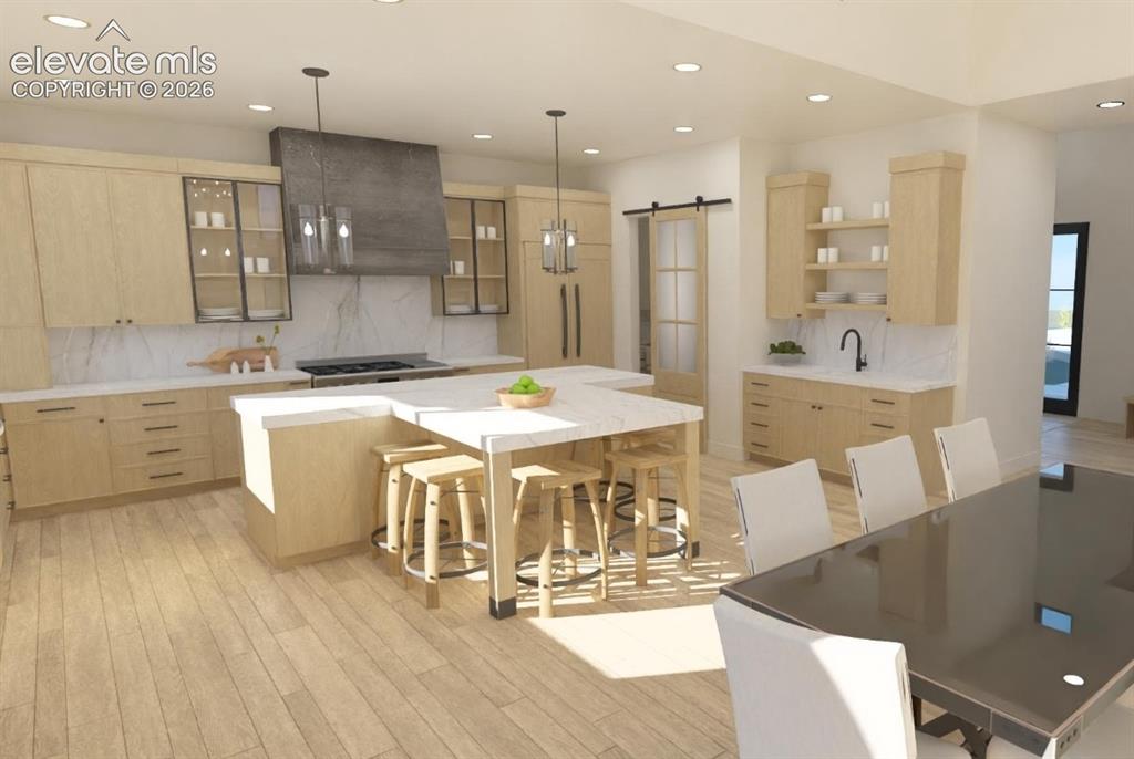 Image 9 of 32: Light wood-finish flooring complements custom cabinetry with integrated app