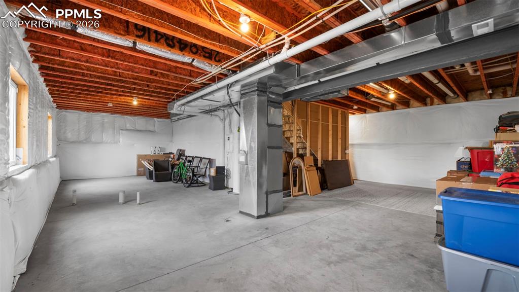 Image 19 of 43: Unfinished basement featuring heating unit