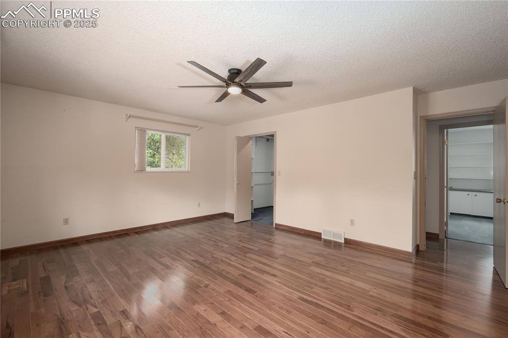 Image 12 of 34: Primary bedroom and walk in closet