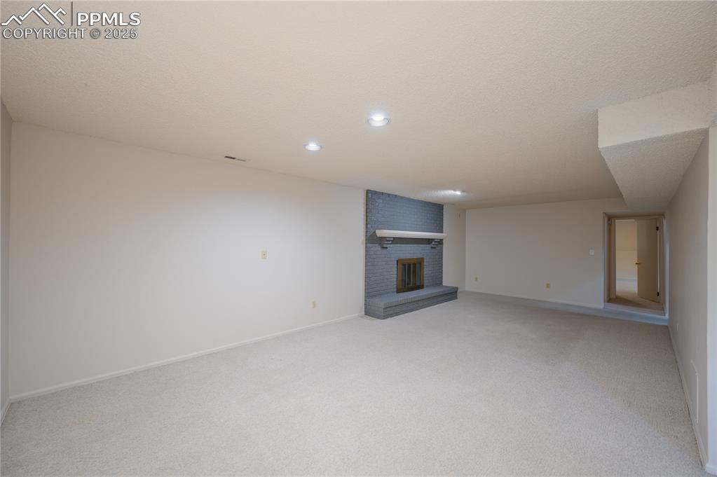 Image 18 of 34: Lower level rec room