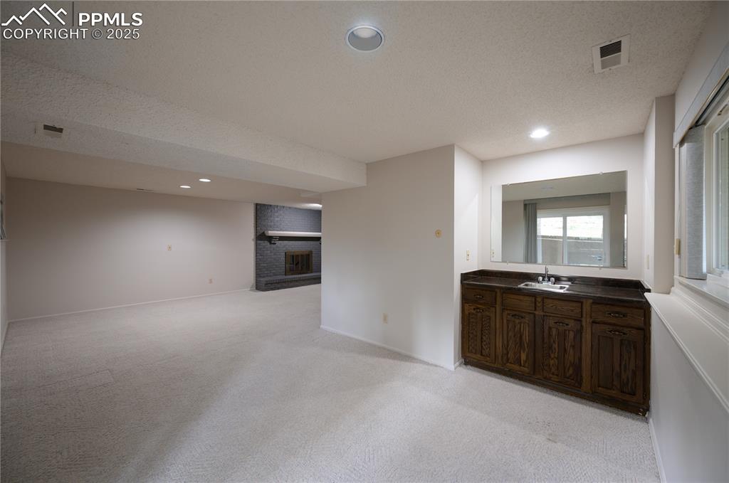 Image 20 of 34: Lower level wet bar