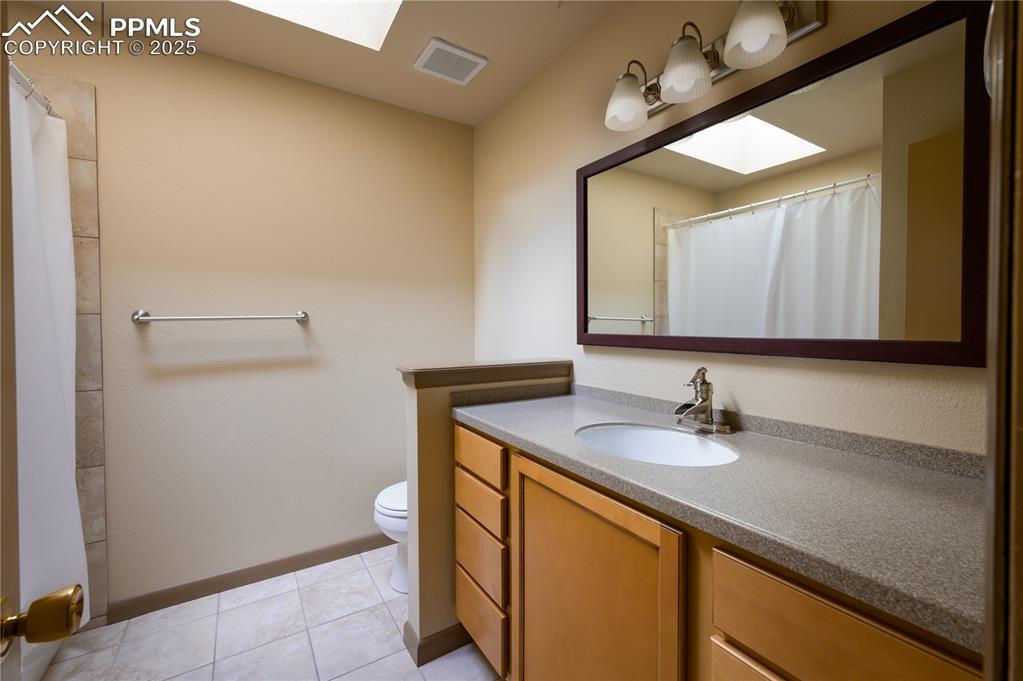 Image 23 of 34: Lower level full bathroom