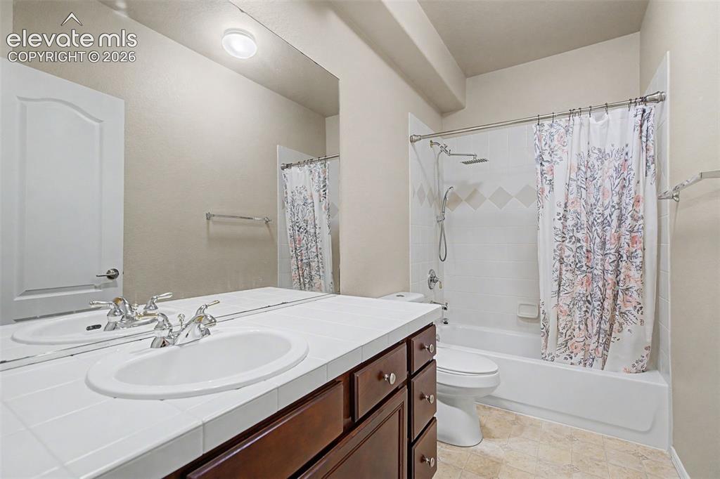 Image 32 of 39: Lower level full bathroom