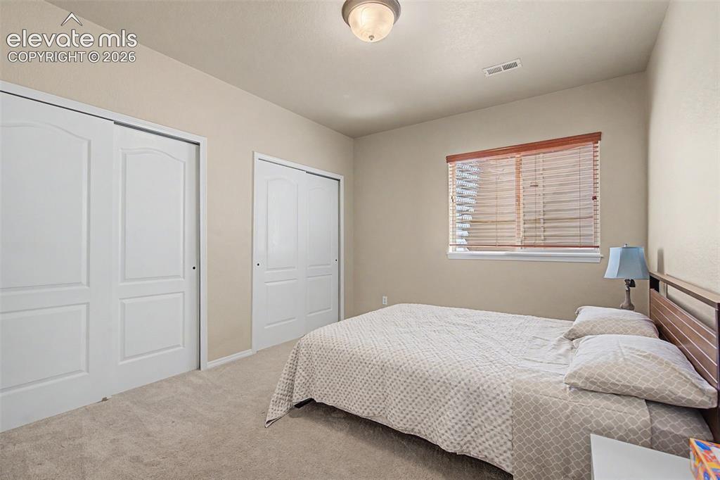 Image 33 of 39: one of three lower level bedrooms