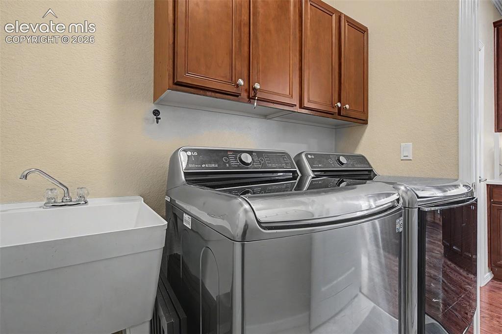 Image 39 of 39: With utility sink in from spacious garage 