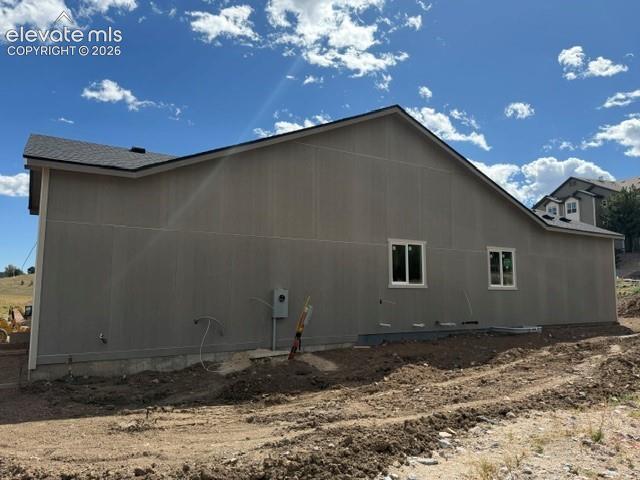 Image 3 of 34: Light gray exterior siding with white-framed windows and a dark shingle roo