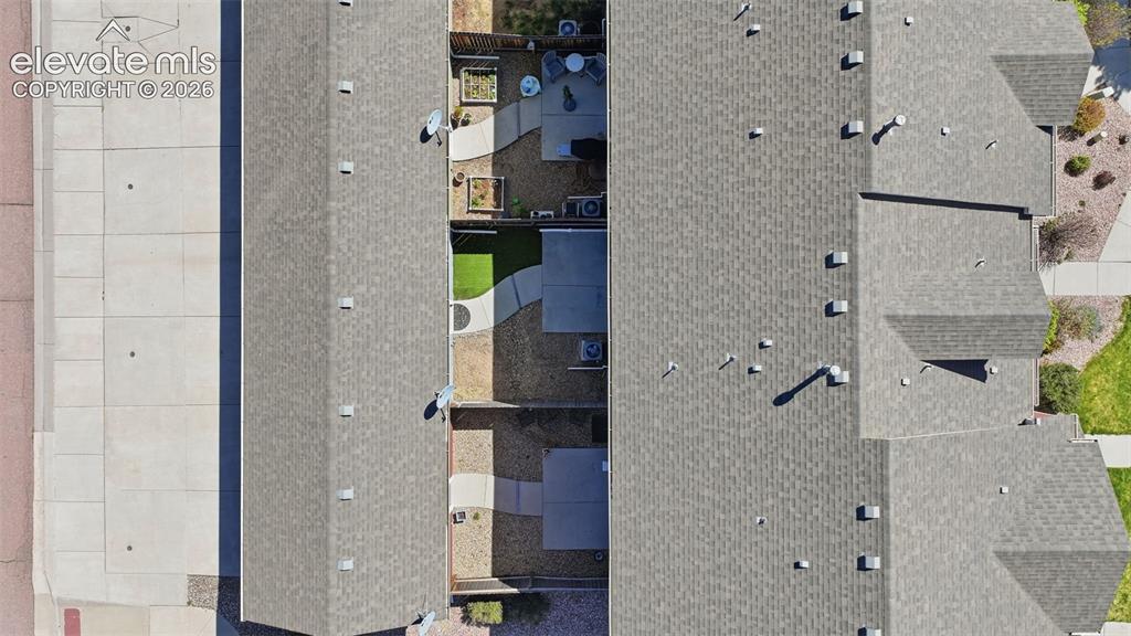 Image 36 of 37: aerial view of unit, yard, and detached garage