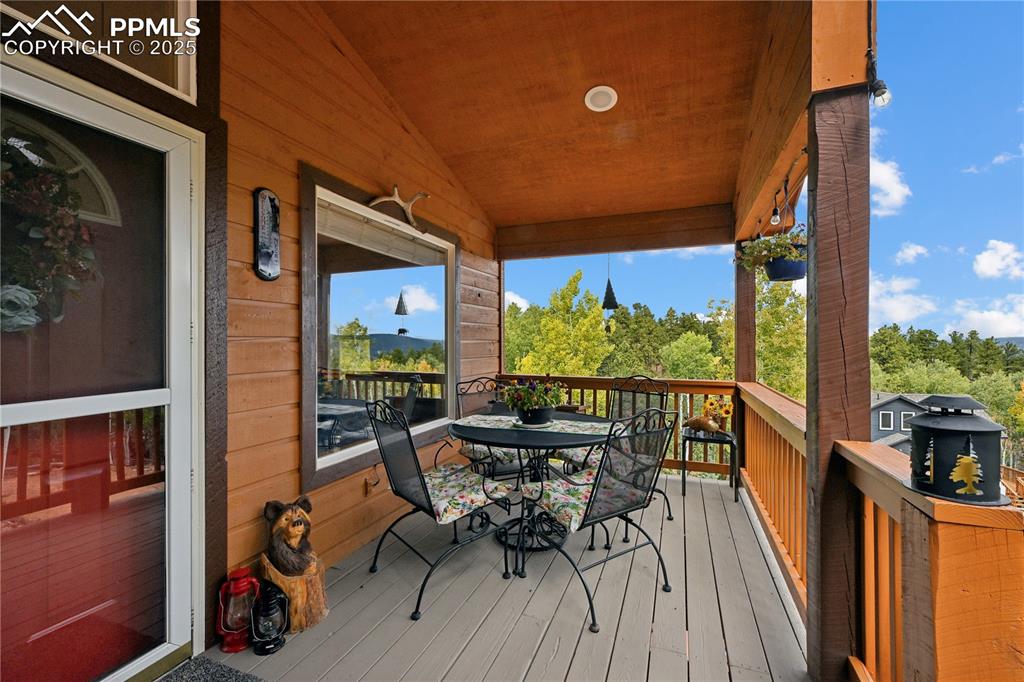 Image 3 of 34: Deck with outdoor dining area