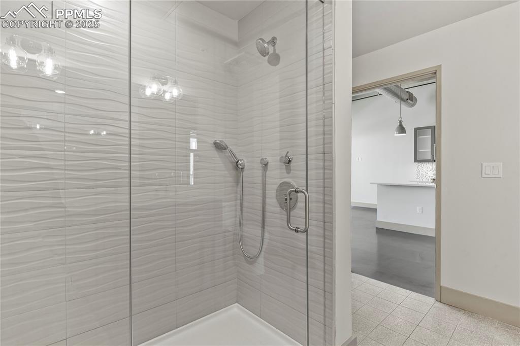 Image 8 of 22: Huge walk-in shower with frameless glass door