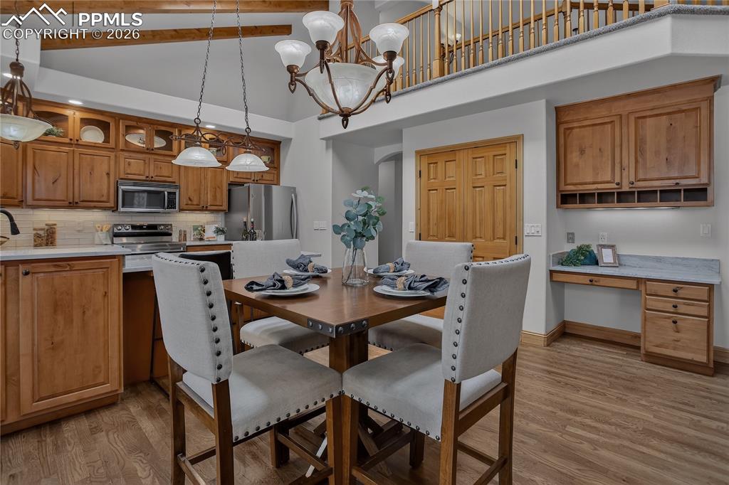 Image 15 of 48: Built-in desk and large pantry complete this fabulous living space