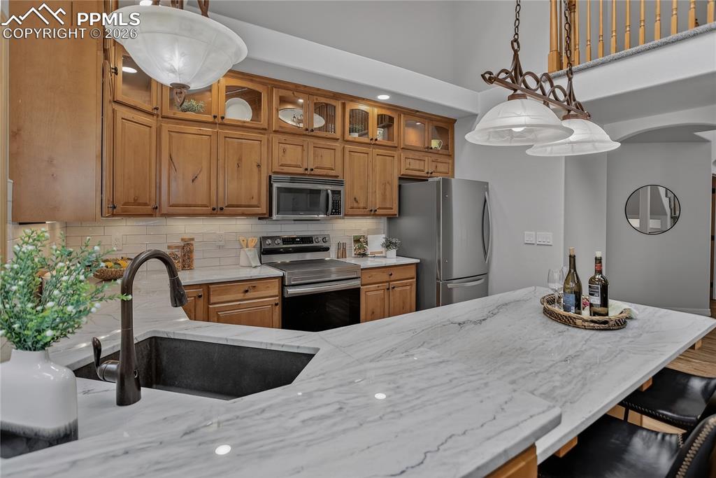 Image 19 of 48: Upgraded Quartzite counter tops and composite sink