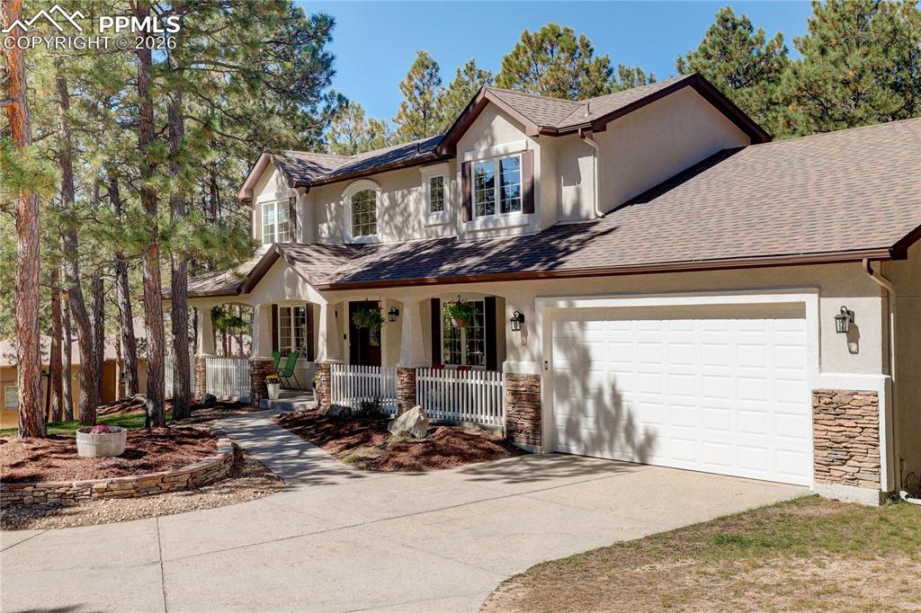 Image 2 of 48: 3-car tandem garage with EV charging station