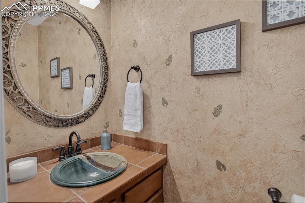 Image 20 of 48: Main-level half bath