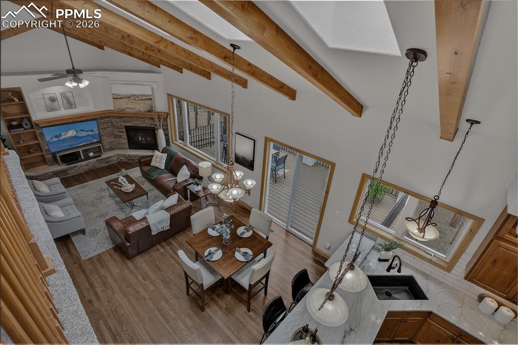 Image 27 of 48: Birds-eye view of the vaulted space with SKYLIGHTS and exposed beams. Much 