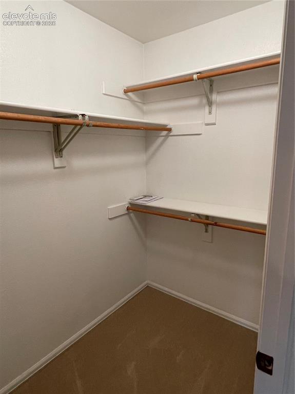 Image 16 of 25: 1st bedroom closet