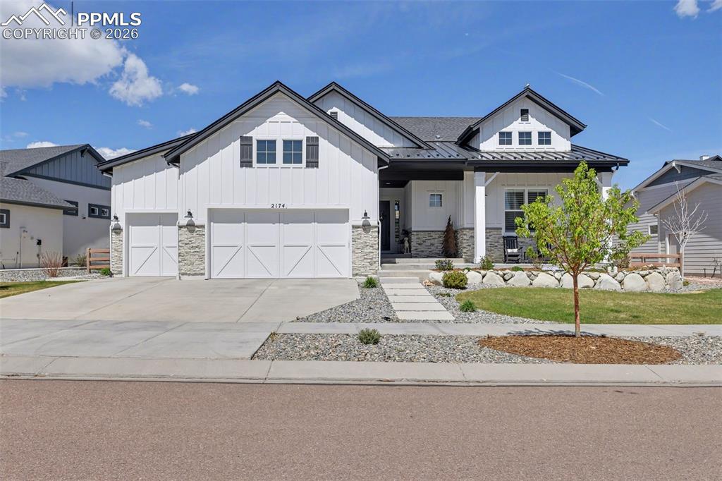 Caption: Arrive in style at this magnificent 2021-built luxury ranch home, showcasing exceptional craftsmansh