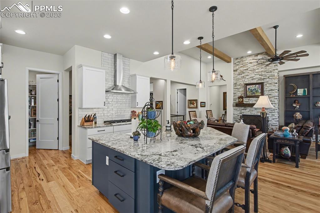 Image 16 of 50: Enjoy a seamless culinary and social experience as the kitchen looks out ov