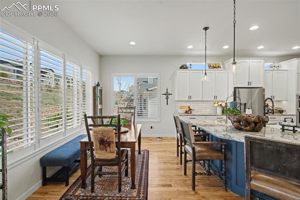 Image 18 of 50: Savor your morning coffee in the sunlit breakfast nook, complete with elega