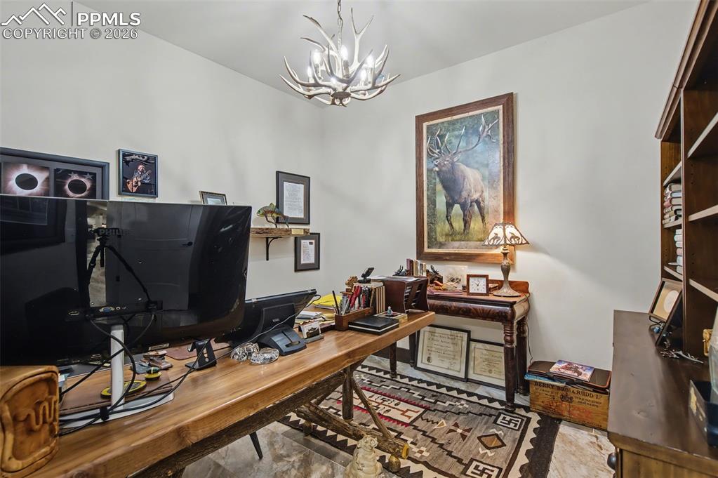 Image 23 of 50: Working from home becomes an absolute pleasure in this private main-level o