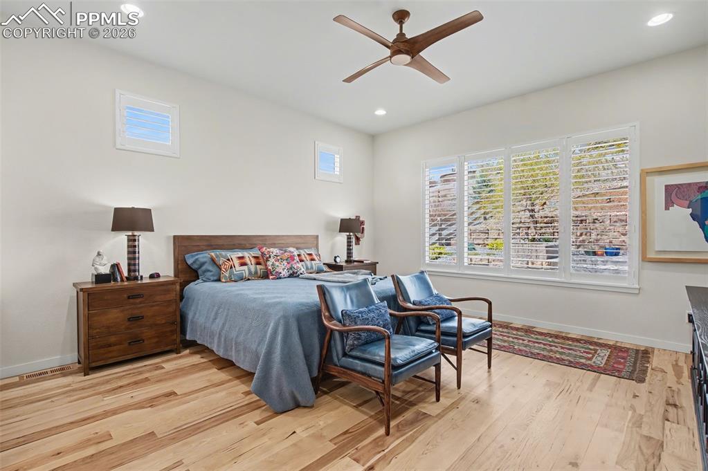 Image 25 of 50: Wake up to brilliant natural light and beautiful views in a main-level prim