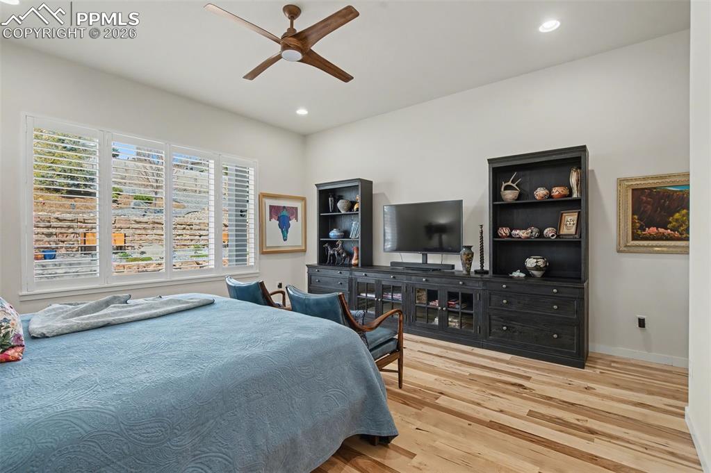 Image 26 of 50: With plenty of room for an entertainment center or seating area, the primar