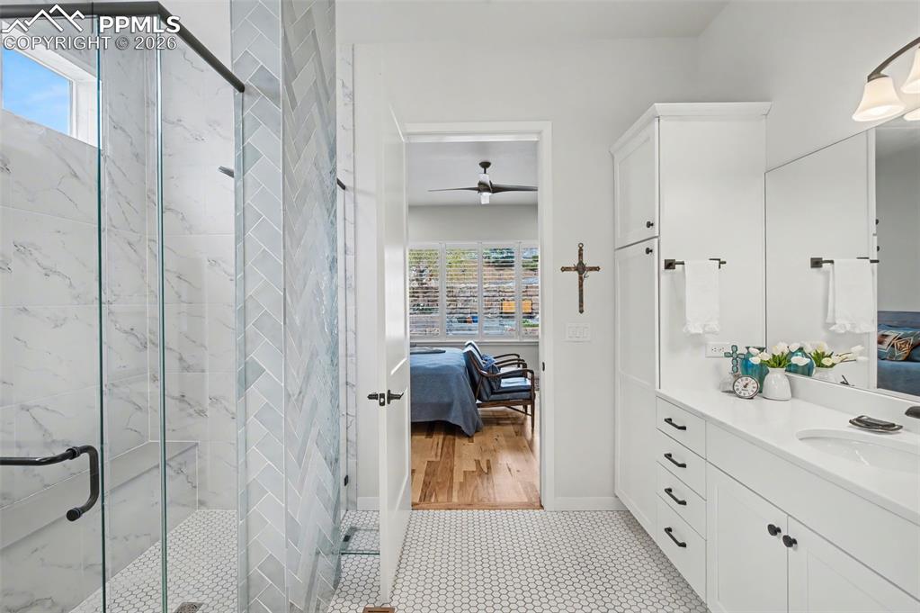 Image 27 of 50: Indulge in the spa-like primary bathroom, showcasing a pristine double vani