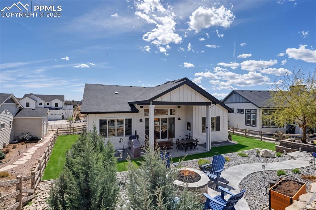 Image 48 of 50: Enjoy seamless indoor-outdoor living in this meticulously designed backyard