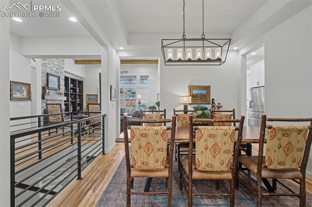 Image 6 of 50: This elegant dining space flows seamlessly into the main living areas, ensu