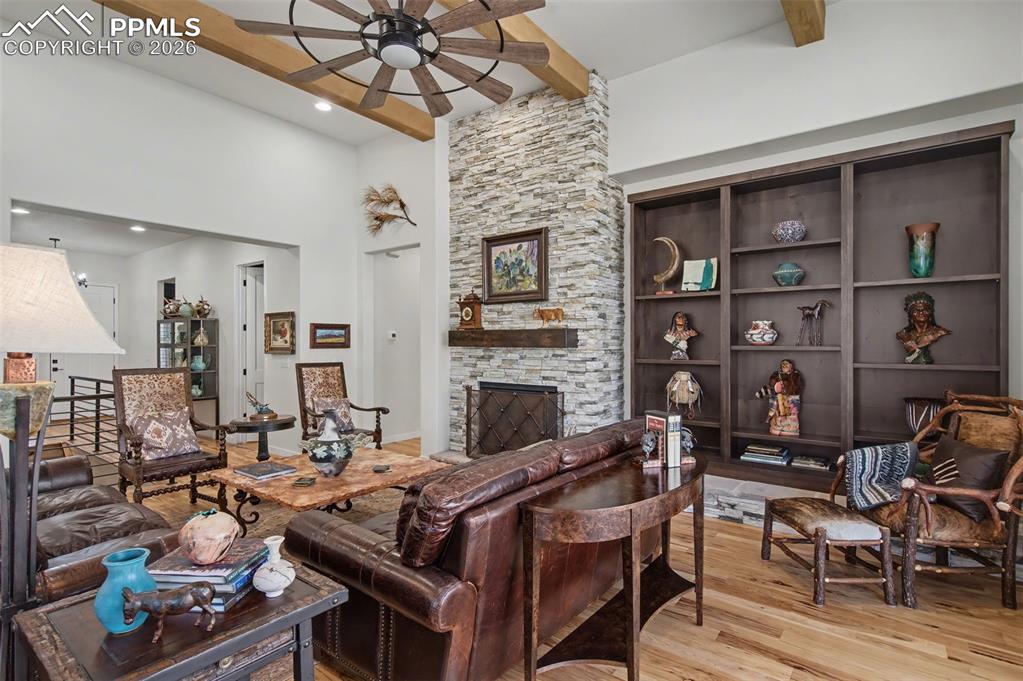 Image 7 of 50: Relax in the spectacular great room, anchored by a striking floor-to-ceilin