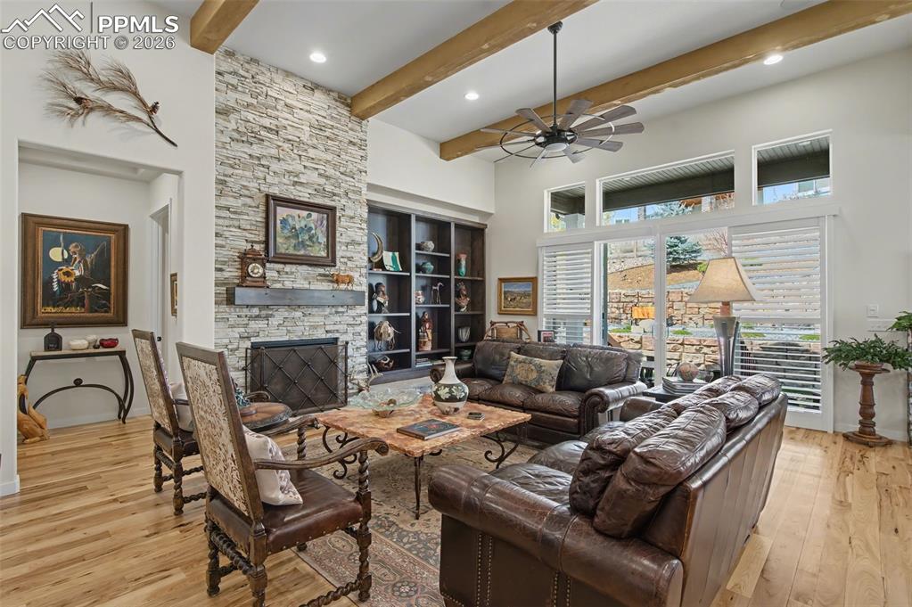 Image 9 of 50: Bathed in natural light, the main living area features elegant natural wood