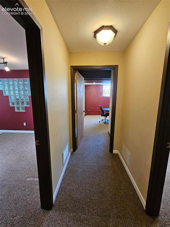 Image 10 of 13: Hallway to conference room