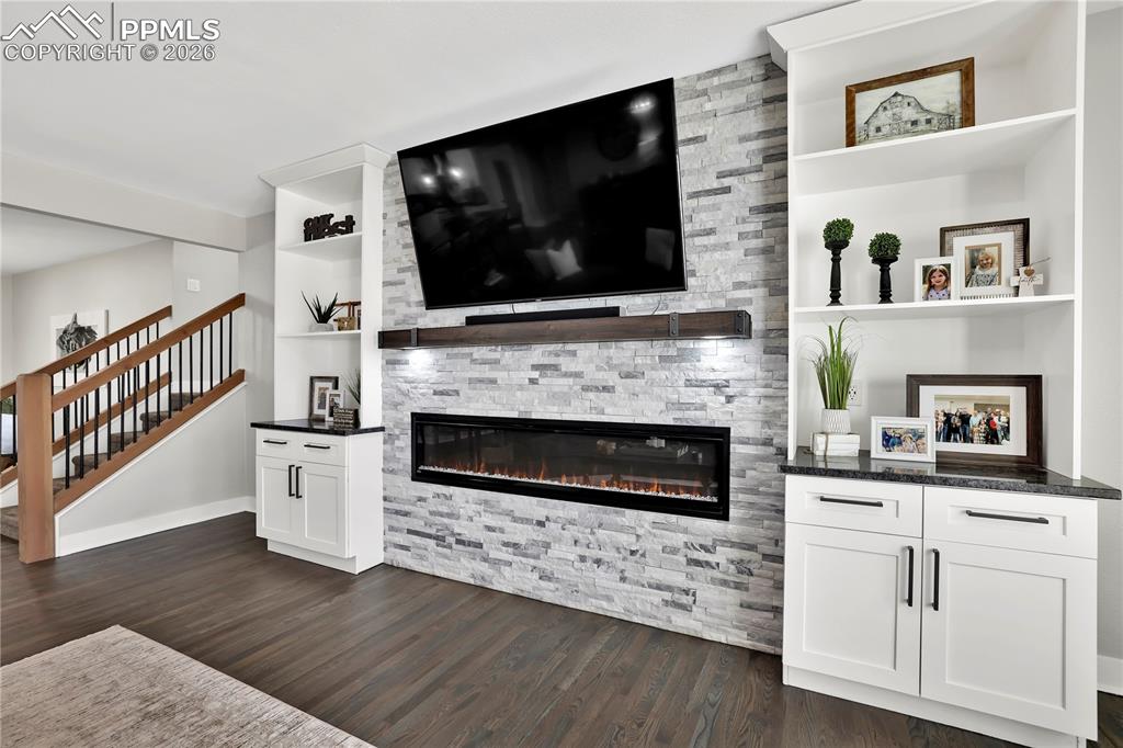Image 13 of 46: This wall is a show stopper in the living room! Custom built and stunning w