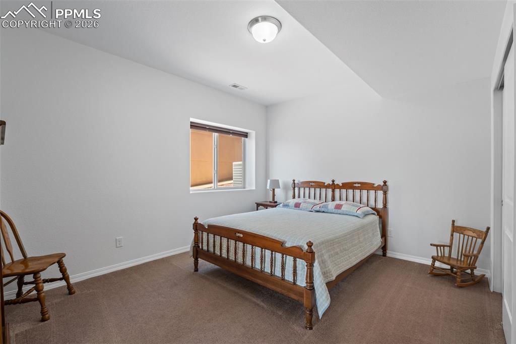 Image 35 of 48: Bedroom featuring carpet floors and baseboards