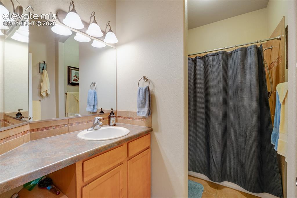Image 17 of 25: Main level guest bathroom