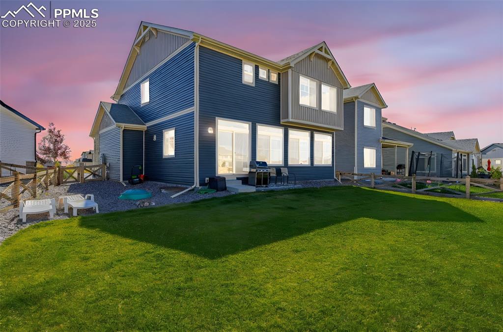 Image 25 of 32: Rear view of property with a patio area