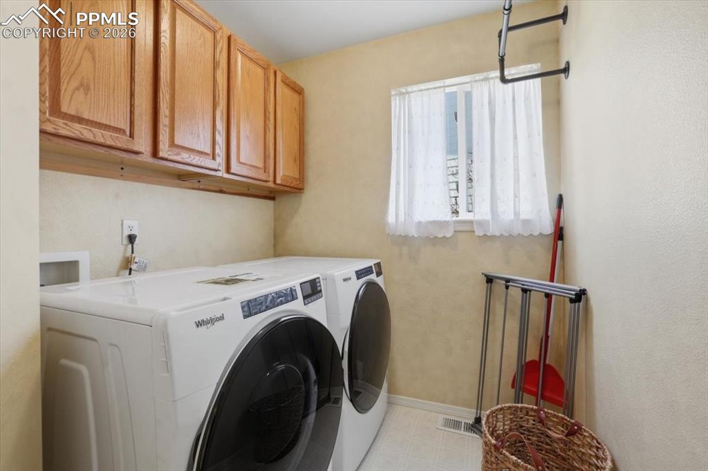 Image 20 of 48: Main level laundry room.