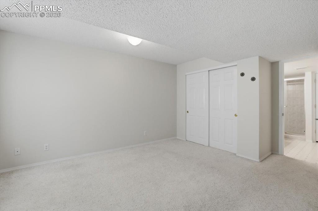 Image 37 of 48: Lower level bedroom.