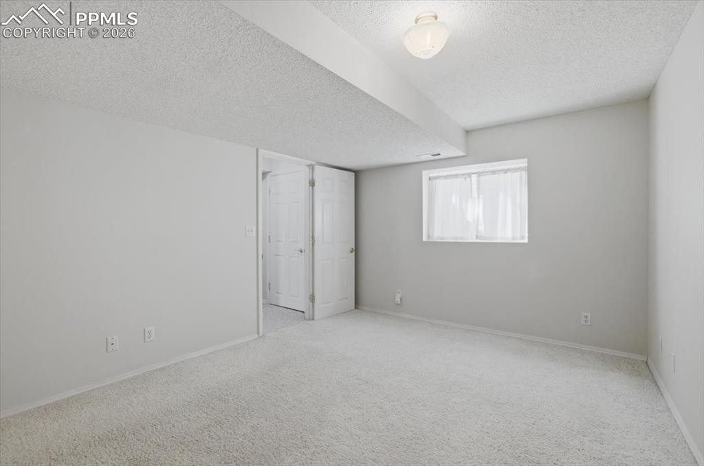 Image 38 of 48: Lower level bedroom.
