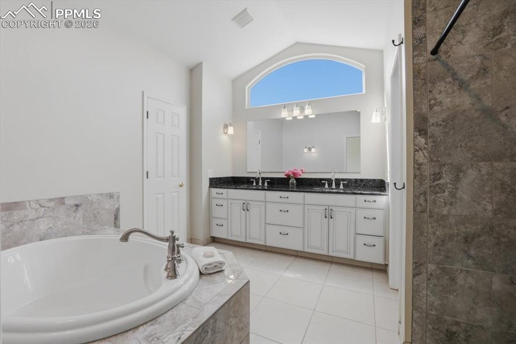 Image 5 of 48: Luxurious primary suite bathroom.