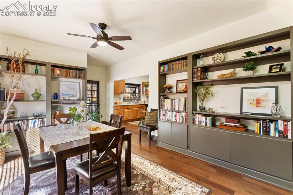 Image 11 of 37: Dining area with skylights and ceiling fan.