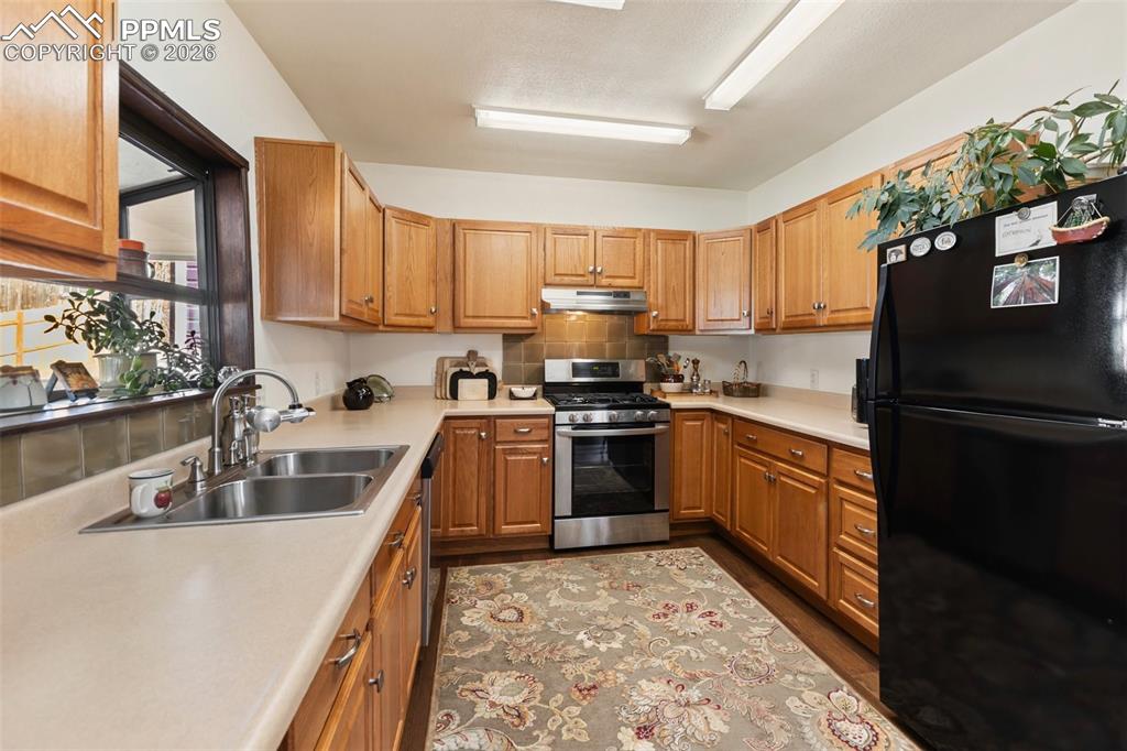 Image 18 of 37: Kitchen skylights bring golden afternoon light into the kitchen.