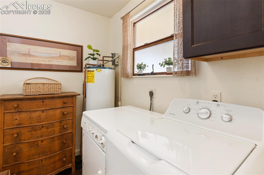 Image 19 of 37: Full laundry space. Perfect for extra storage options.