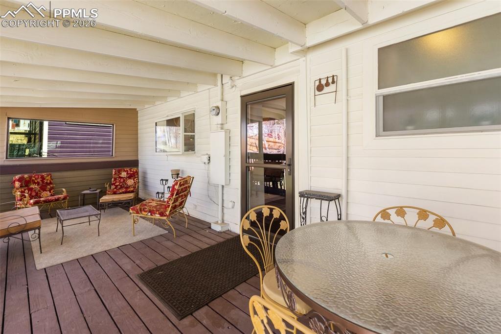 Image 32 of 37: Wood deck with walkout from the kitchen. Well maintained. Great space for e