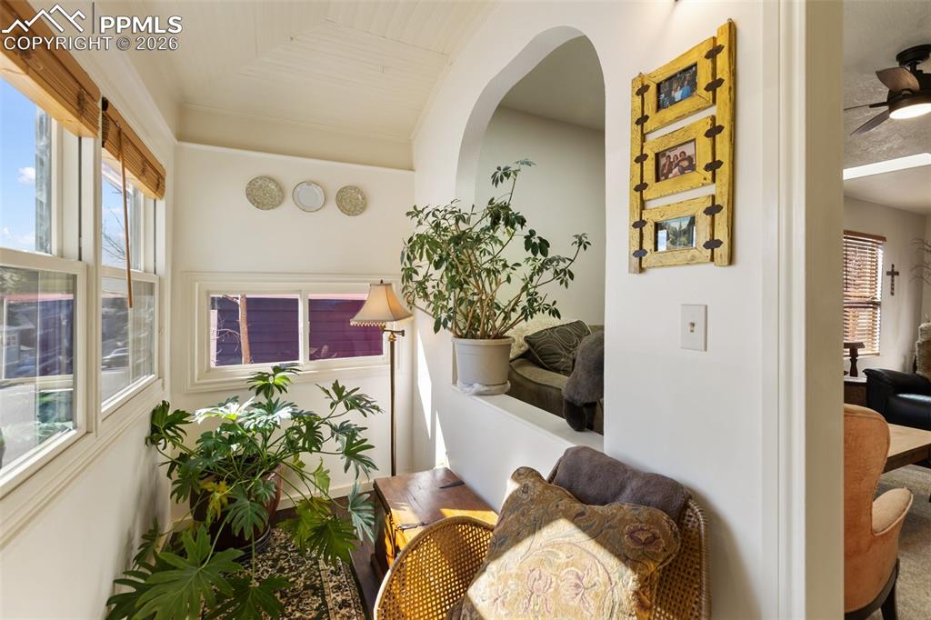 Image 4 of 37: Sunroom with architectural details. Plants thrive in this zone.