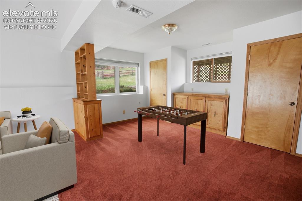 Image 18 of 36: Lower Level Family Room -Virtually Staged