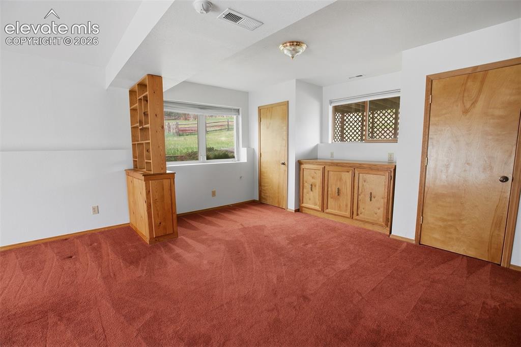 Image 35 of 36: Lower Level Family Room