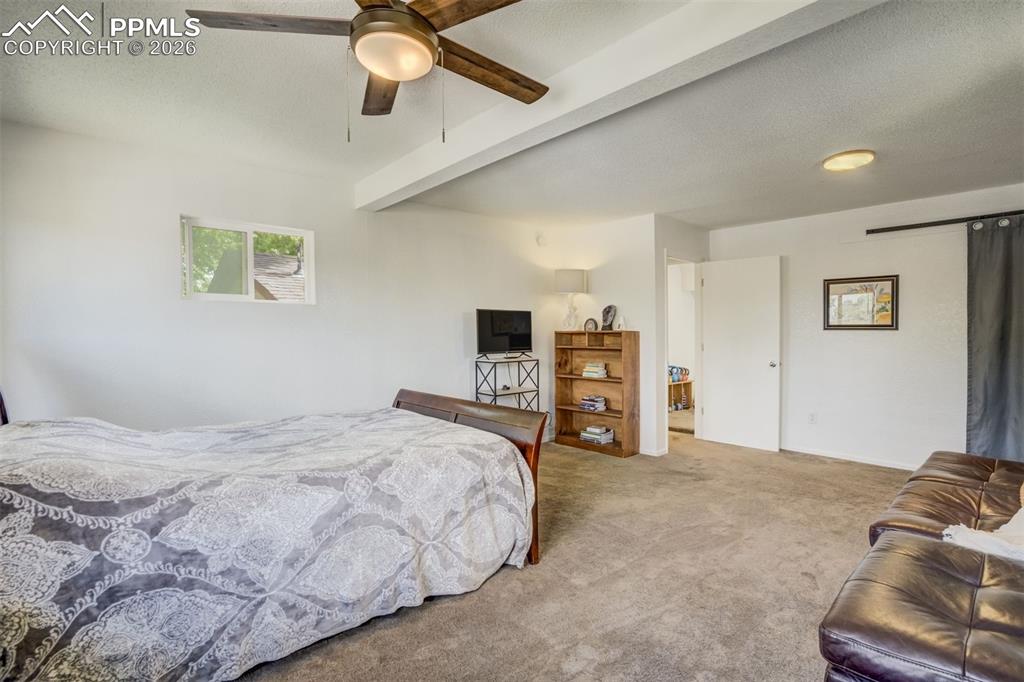 Image 15 of 44: Primary bedroom with sitting area