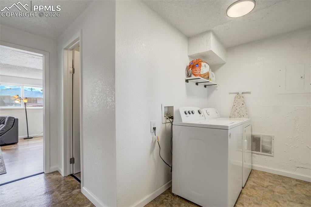 Image 36 of 44: Laundry area with walk out