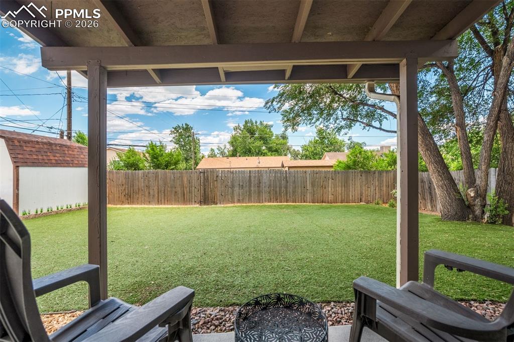 Image 39 of 44: Fenced backyard