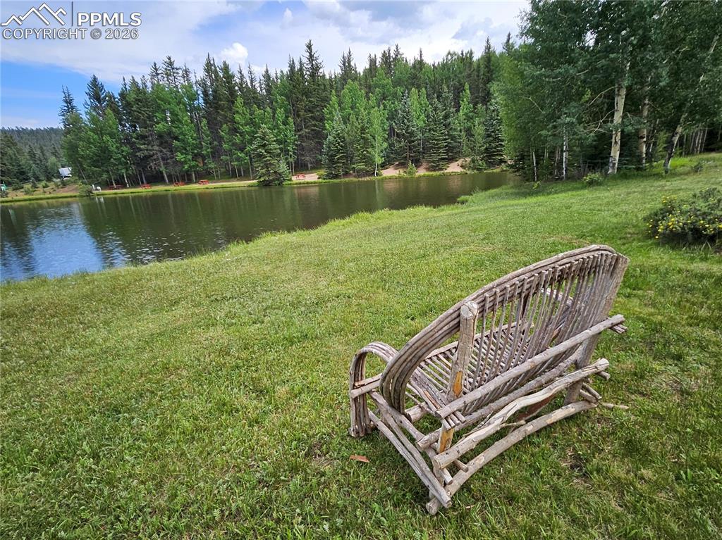 Image 41 of 47: Bench Overlooking Community Pond.